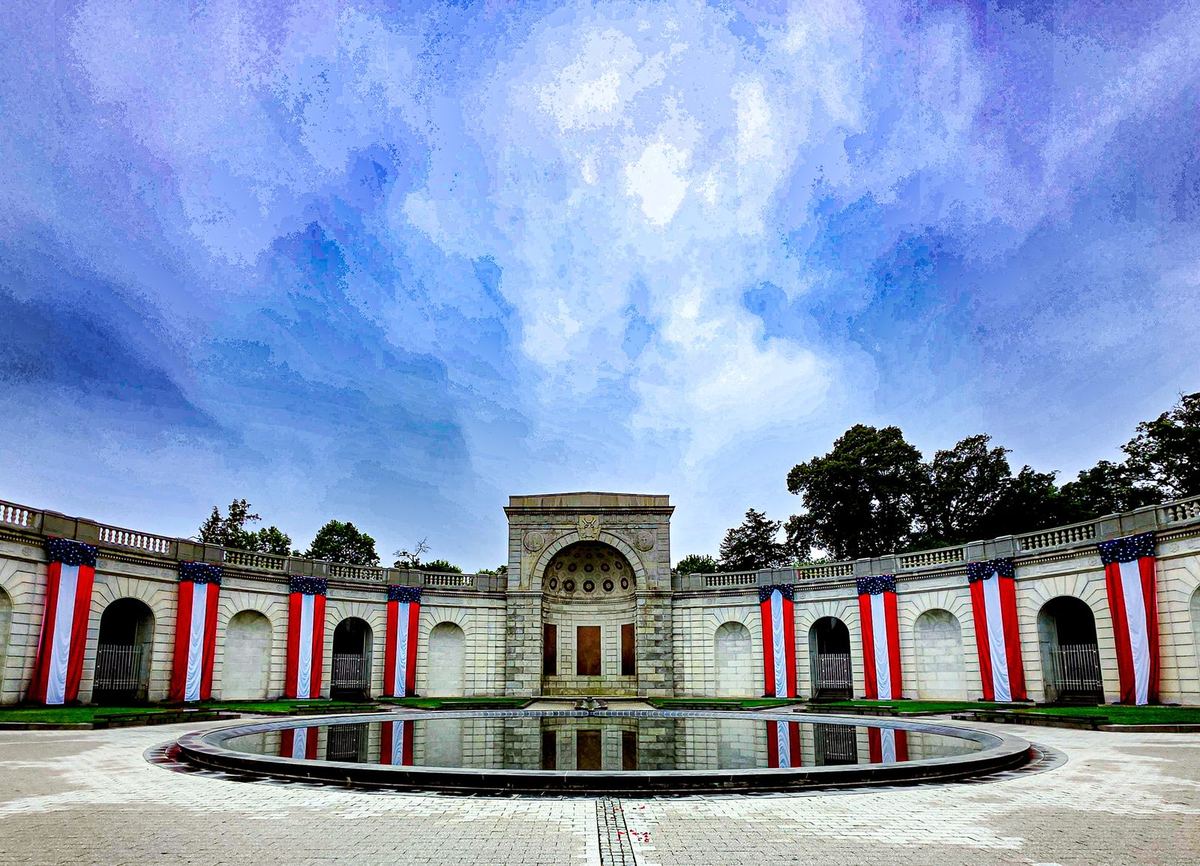 The Women in Military Service for America Memorial archway, draped with American flags